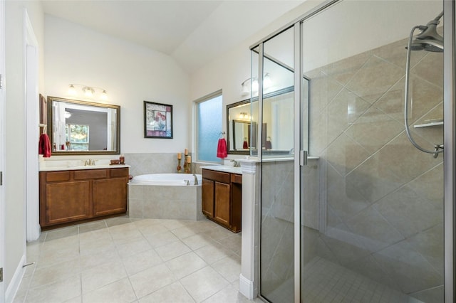 bathroom featuring plus walk in shower, vanity, a wealth of natural light, and lofted ceiling