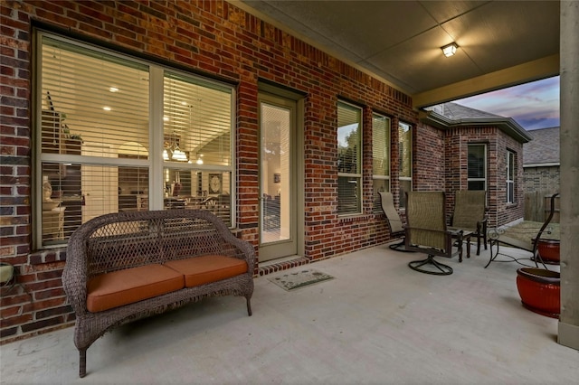 view of patio terrace at dusk