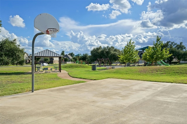 view of sport court with a lawn, a gazebo, and a playground