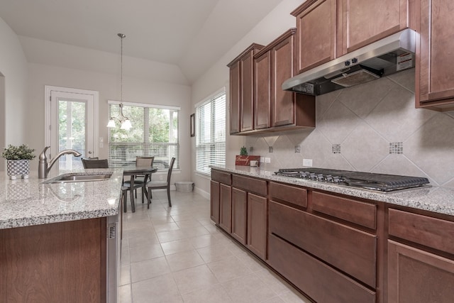 kitchen featuring extractor fan, stainless steel gas stovetop, a healthy amount of sunlight, and sink