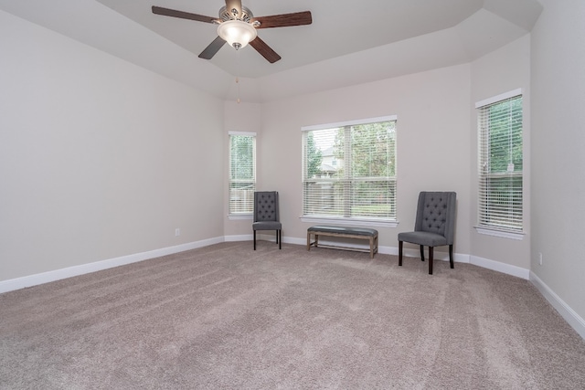 unfurnished room featuring ceiling fan and light carpet