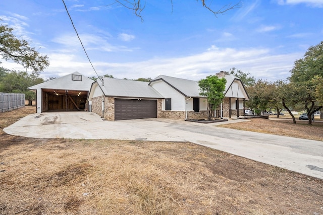 view of front of property featuring a porch, a garage, and a carport