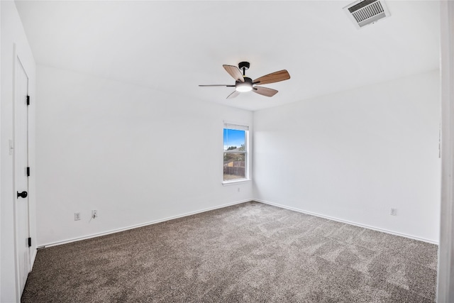 carpeted empty room featuring ceiling fan