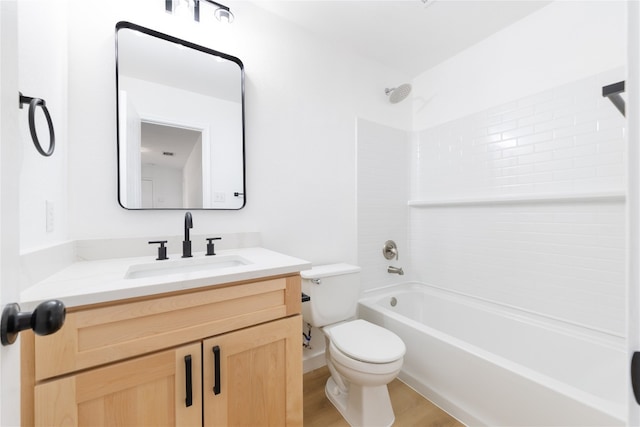 full bathroom featuring vanity, hardwood / wood-style floors, toilet, and bathing tub / shower combination