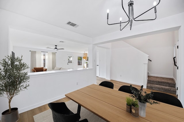 dining area featuring hardwood / wood-style flooring and ceiling fan