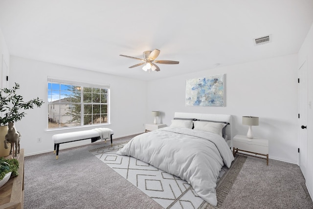 bedroom with ceiling fan and light carpet