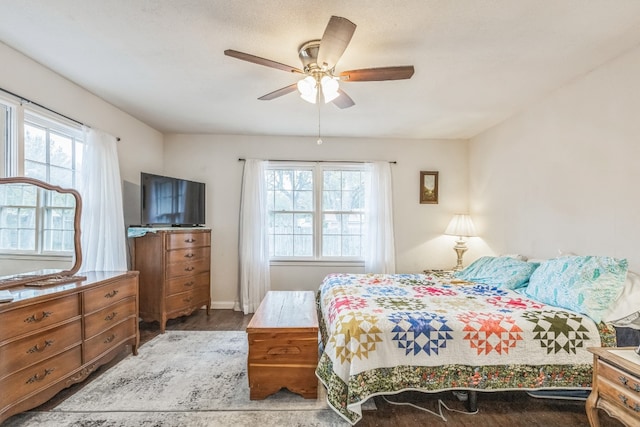 bedroom featuring hardwood / wood-style floors and ceiling fan