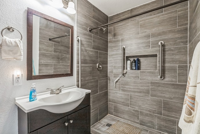 bathroom with vanity, a textured ceiling, and a shower with curtain