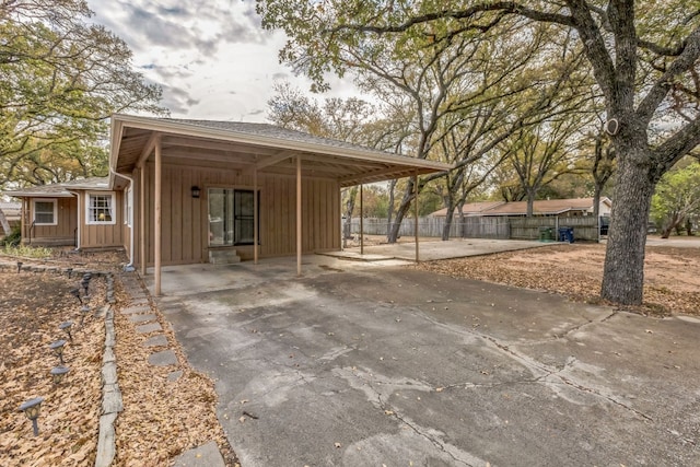 exterior space with a carport