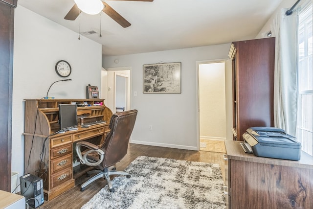 office space with ceiling fan and dark hardwood / wood-style floors