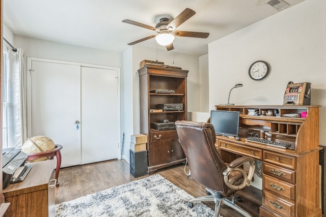 office area with hardwood / wood-style floors and ceiling fan