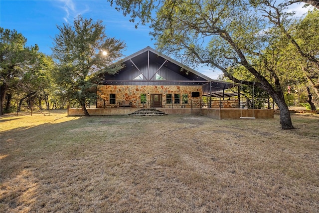 exterior space with a deck and a lawn