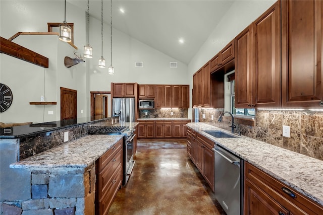 kitchen featuring light stone counters, a kitchen island, high vaulted ceiling, pendant lighting, and stainless steel appliances