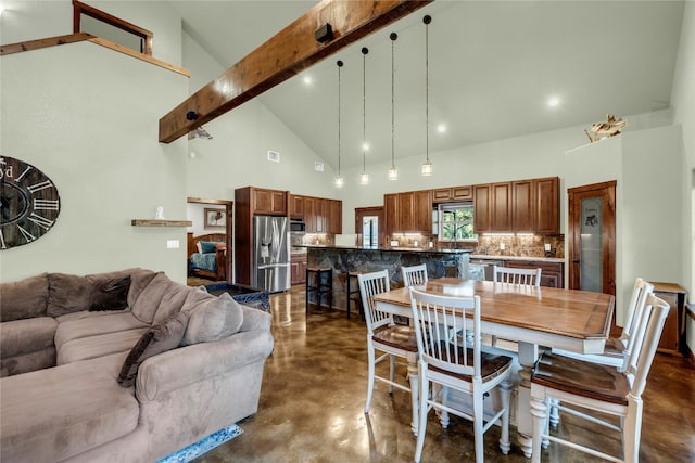 dining room with high vaulted ceiling, beamed ceiling, and sink