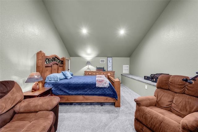 carpeted bedroom with vaulted ceiling