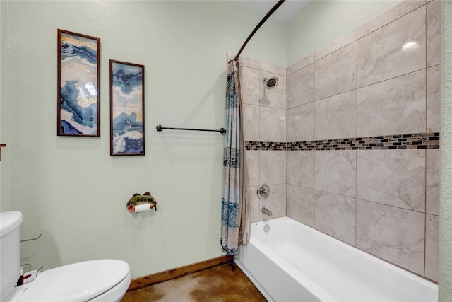 bathroom with toilet and shower / tub combo with curtain