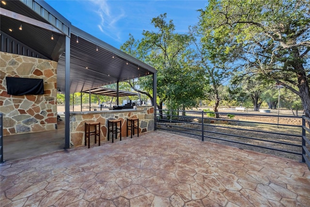 view of patio / terrace with an outdoor bar