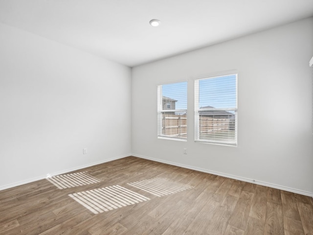 empty room with wood-type flooring