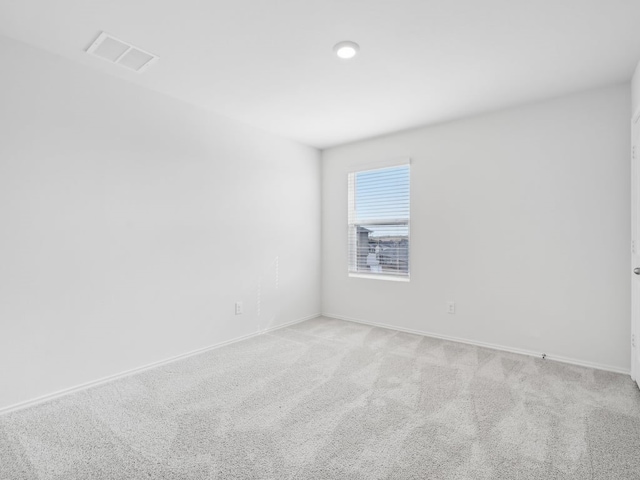 spare room with light colored carpet