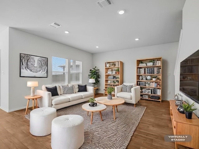 living room with dark hardwood / wood-style flooring