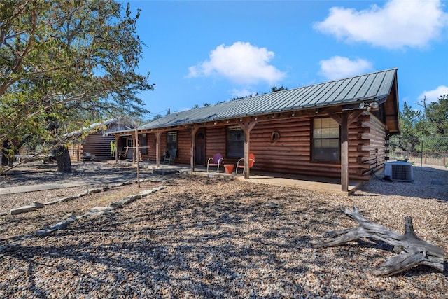 back of house featuring central AC unit