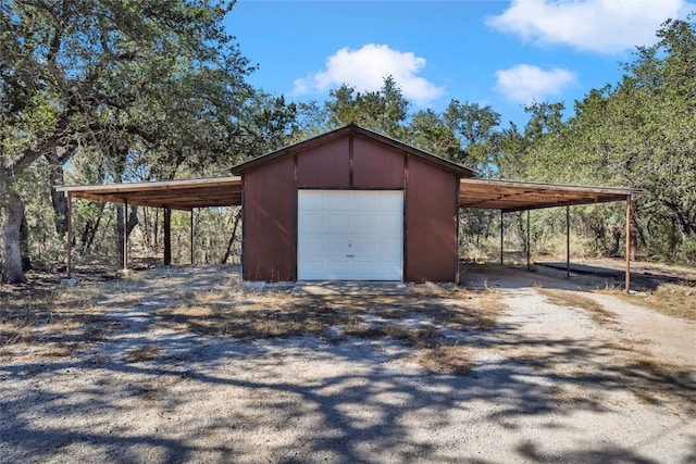 garage featuring a carport