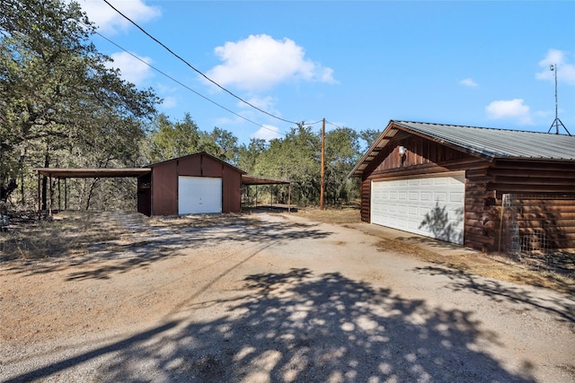 view of side of property featuring an outdoor structure and a garage