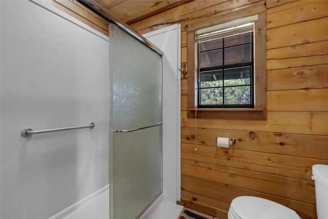 bathroom featuring wooden ceiling, toilet, walk in shower, and wooden walls