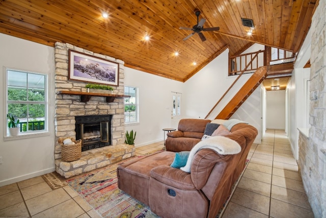 living room featuring a wealth of natural light, wood ceiling, high vaulted ceiling, and light tile patterned floors