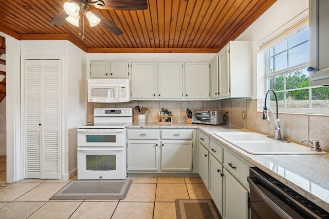 kitchen featuring decorative backsplash, wooden ceiling, sink, light tile patterned flooring, and white appliances