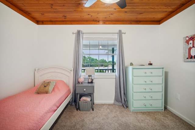 carpeted bedroom with ceiling fan and wood ceiling