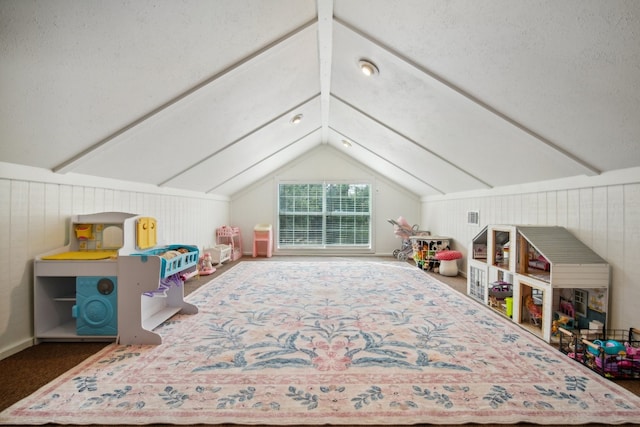 game room featuring wooden walls and vaulted ceiling