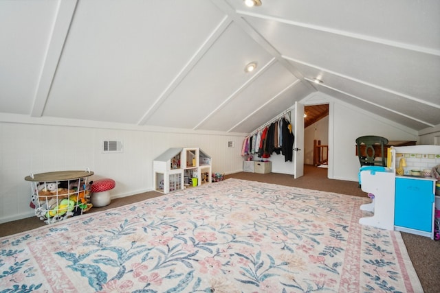 bonus room with lofted ceiling, wooden walls, and dark carpet