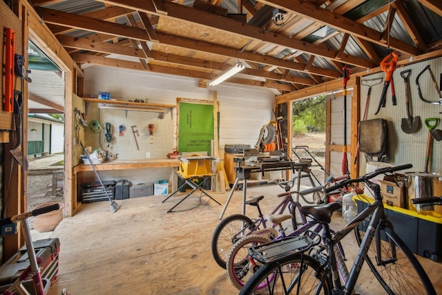 misc room featuring a workshop area and lofted ceiling