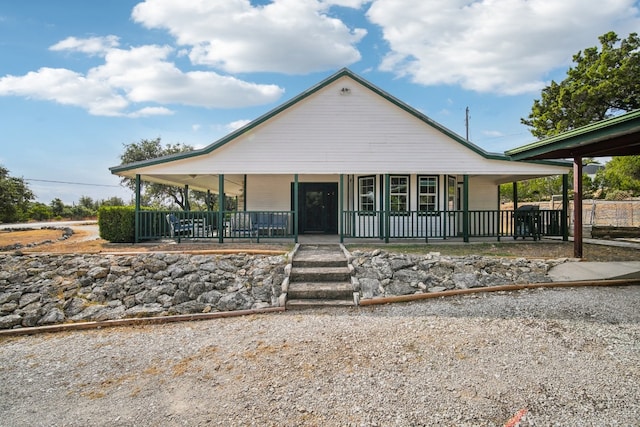 farmhouse inspired home with covered porch