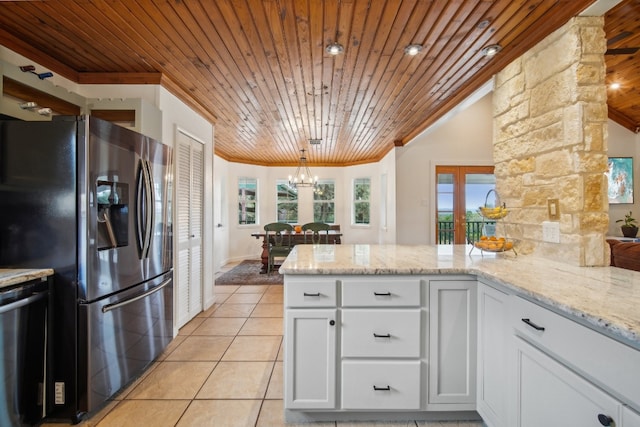 kitchen with white cabinets, wood ceiling, decorative light fixtures, and stainless steel appliances