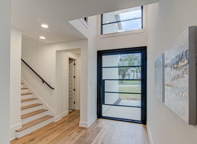 entryway with light hardwood / wood-style floors