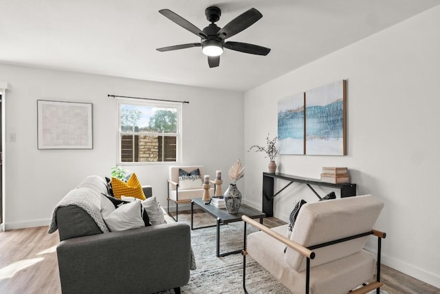 5616 Emerald Forest Dr Unit 101, Austin, TX 78745 - living area featuring baseboards, wood finished floors, and a ceiling fan