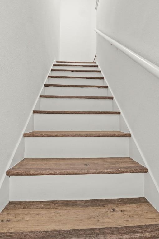 5616 Emerald Forest Dr Unit 101, Austin, TX 78745 - stairs with wood finished floors