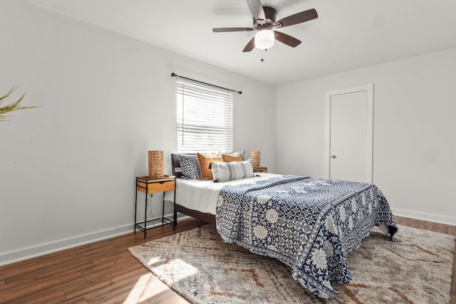 bedroom with hardwood / wood-style flooring and ceiling fan