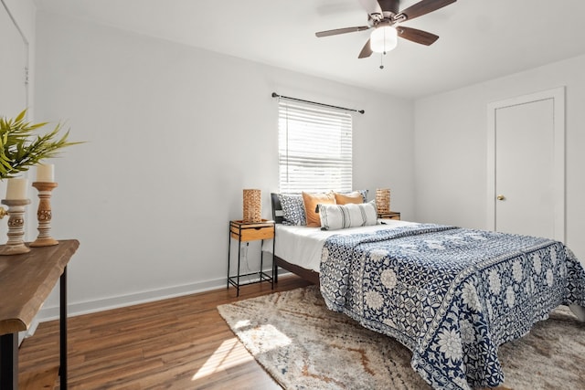 bedroom featuring hardwood / wood-style flooring and ceiling fan