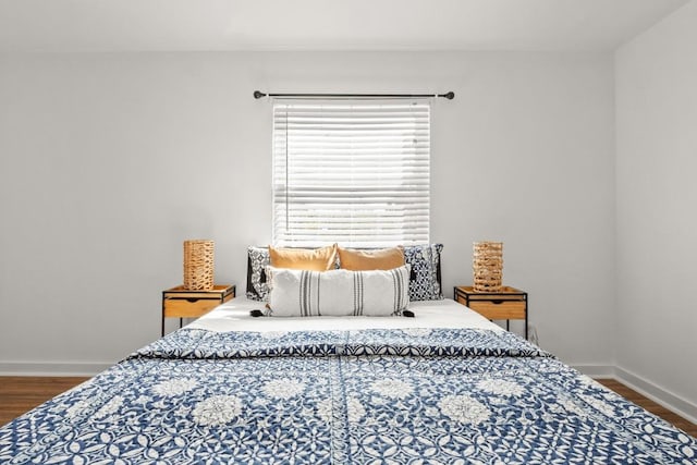 5616 Emerald Forest Dr Unit 101, Austin, TX 78745 - bedroom featuring wood finished floors and baseboards