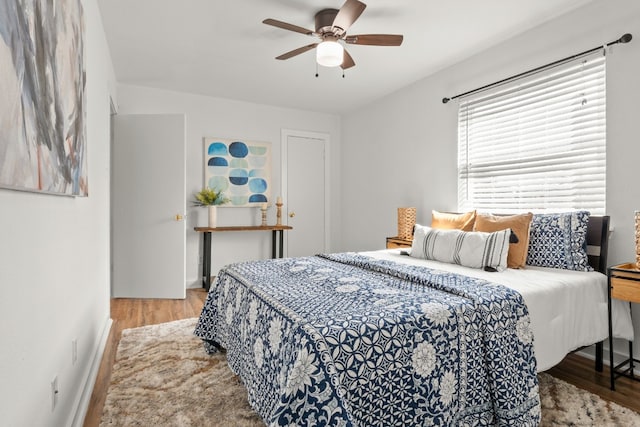 bedroom featuring light wood-type flooring and ceiling fan