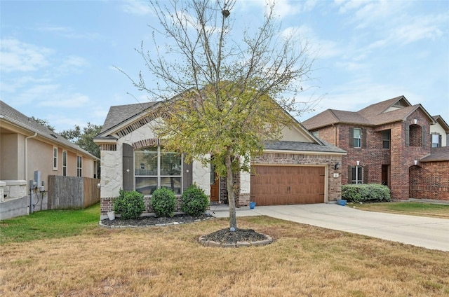 view of front of home featuring a front yard and a garage