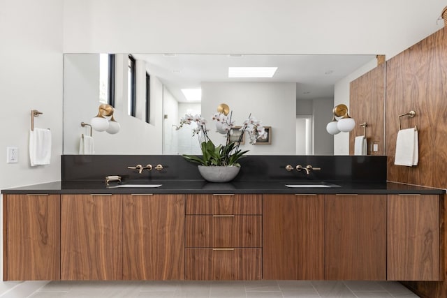 welcome area featuring a skylight and sink