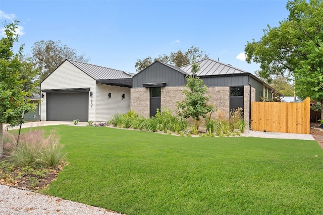 view of front facade with a garage and a front yard