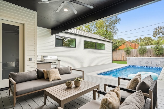 view of swimming pool with outdoor lounge area, ceiling fan, grilling area, and a deck