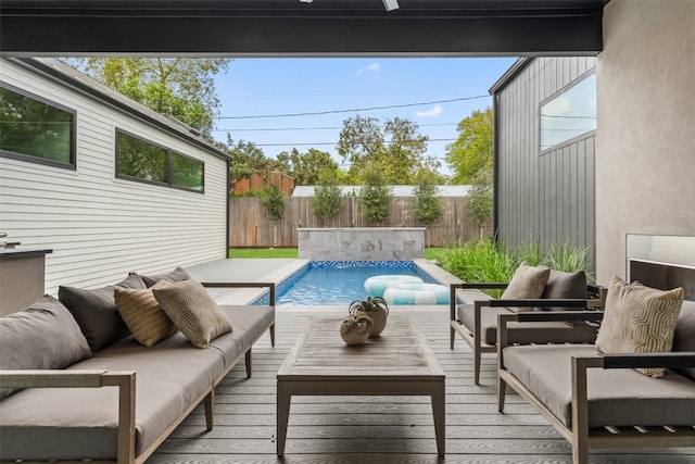 exterior space featuring a fenced in pool and outdoor lounge area