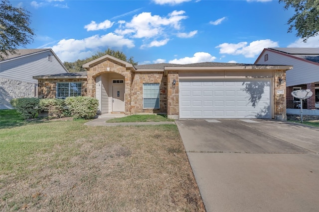 ranch-style house featuring a front lawn and a garage