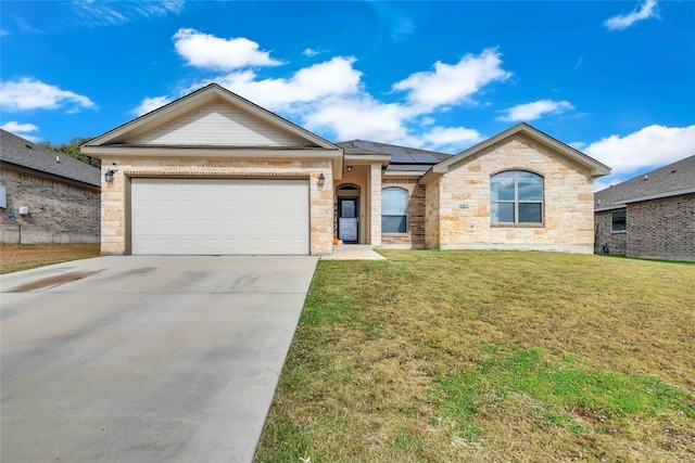 ranch-style home with a garage and a front yard